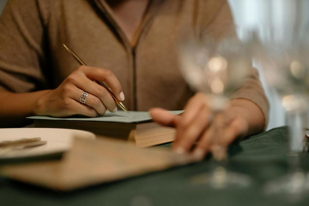 a woman writing on the paper